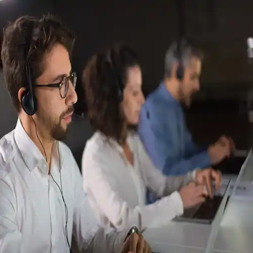 IT AMC Services concentrated bearded call center operator working 1 IT support team managing business infrastructure