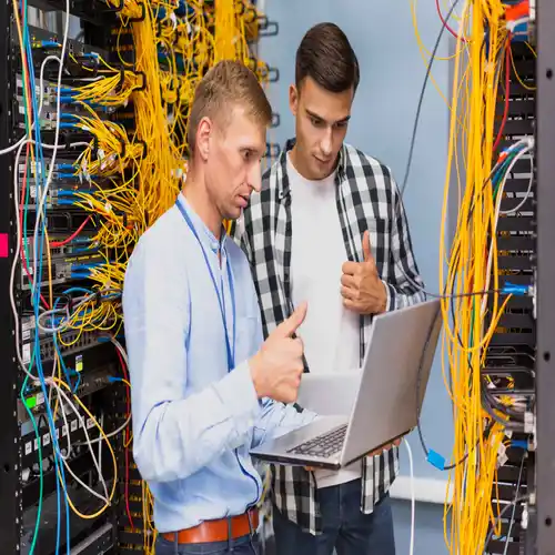 New Office IT Setup young network engineers with laptop medium shot 1 Ongoing IT Support & AMC in new office IT